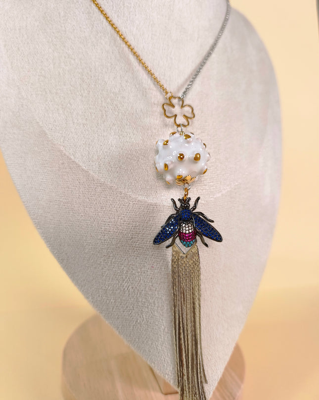 Pendant on a long chain.