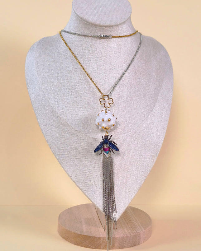 Pendant on a long chain.