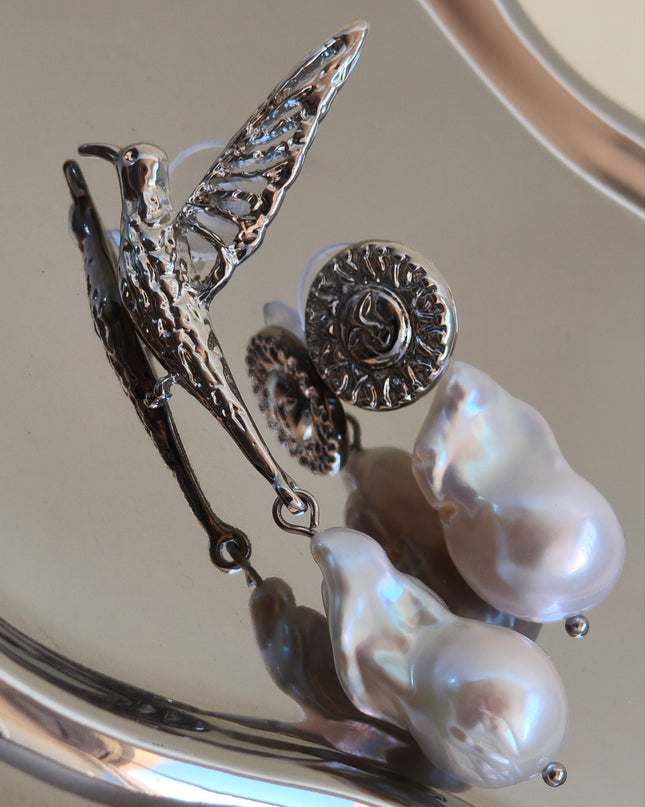 Pendientes Asimétricos